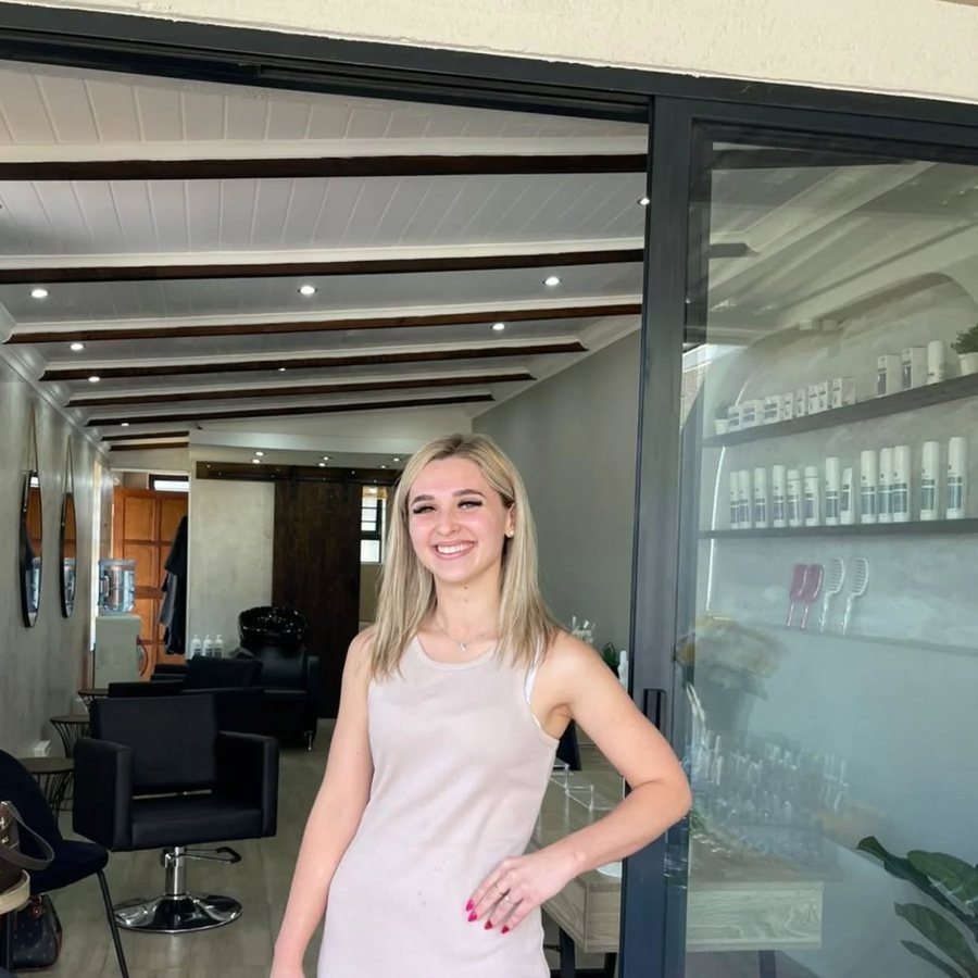 Senovia in the doorway of her salon, Beauty Laboratory, in Pretoria